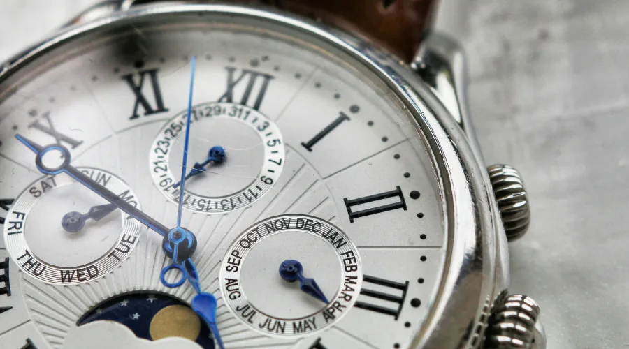 Refined perpetual calendar dress watch dial closeup, representing heirloom-quality complication and formal wedding horology
