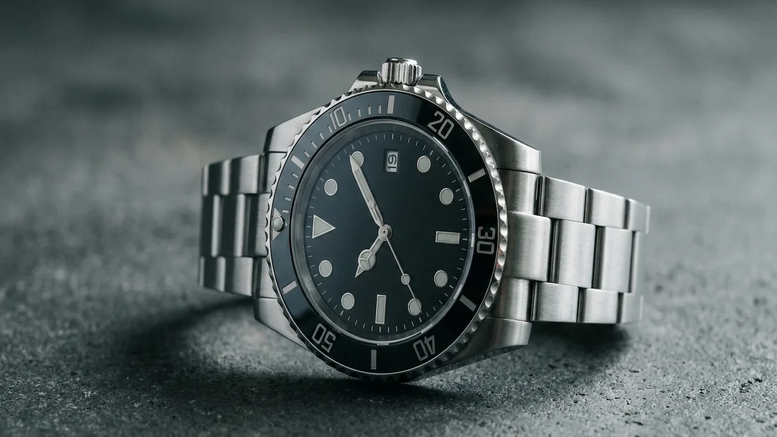 Stainless steel professional dive watch with black dial and rotating bezel